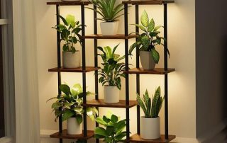 Wooden plant stand with multiple shelves displaying indoor potted plants and decorative lighting. Plant pot stand